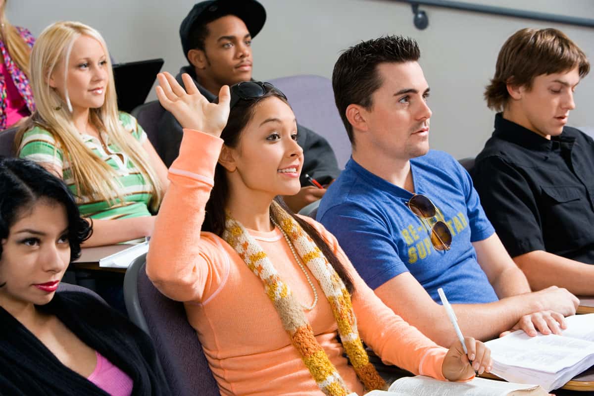 Student raising hand during lecture